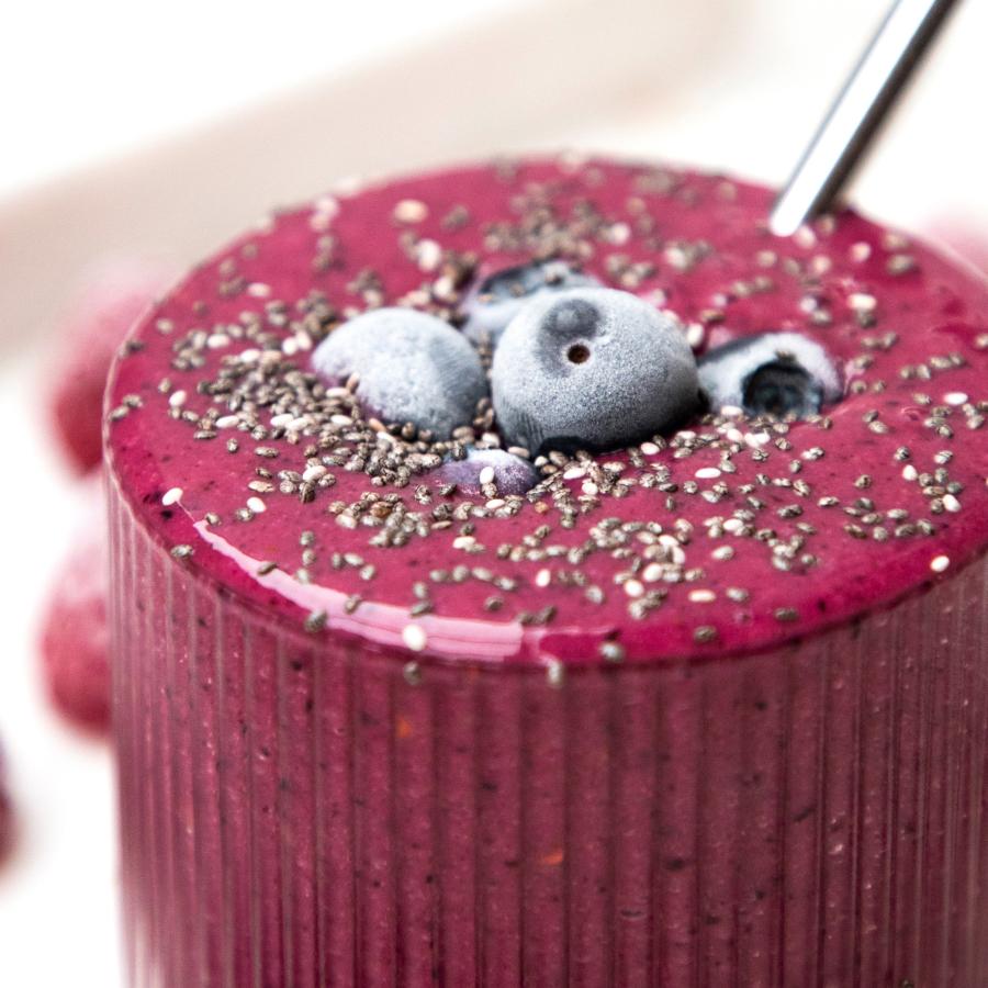 Berry smoothie topped with blueberries and chia seeds